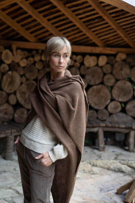 model wearing a chocolate brown coloured alpaca shawl from uk based brand alpaca apparel