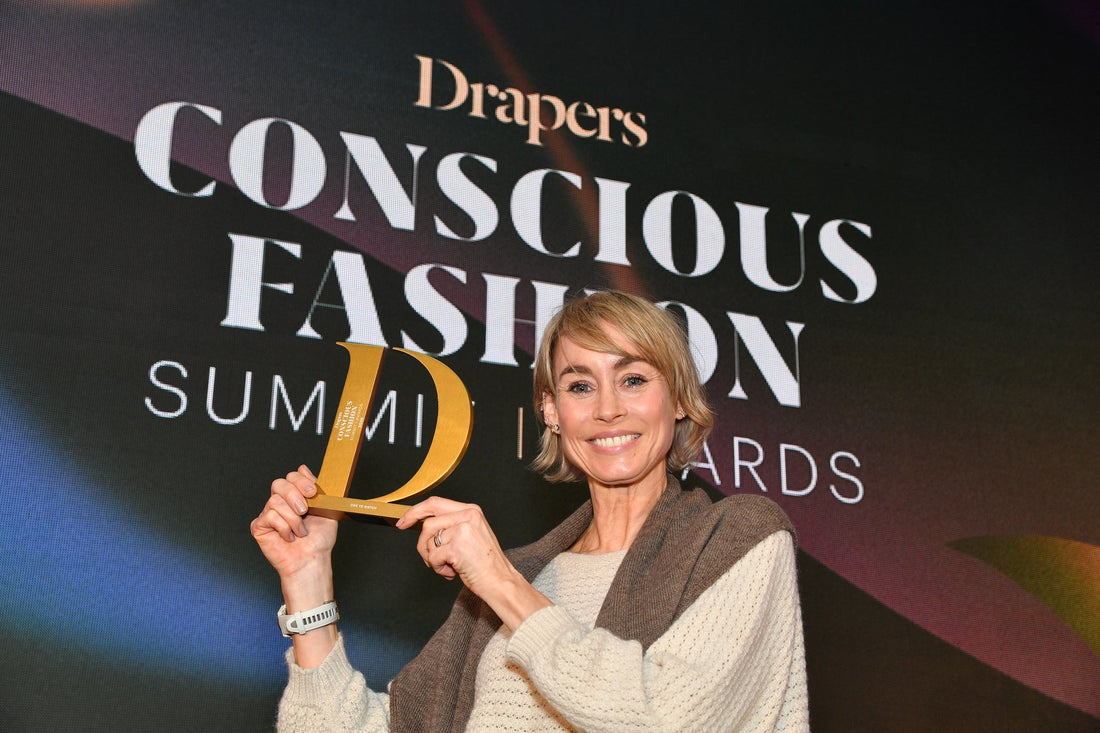woman holding an award