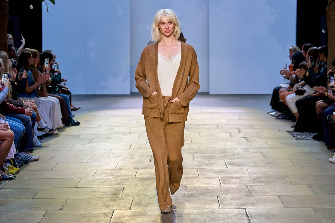 model walking down a fashion runway wearing alpaca clothing